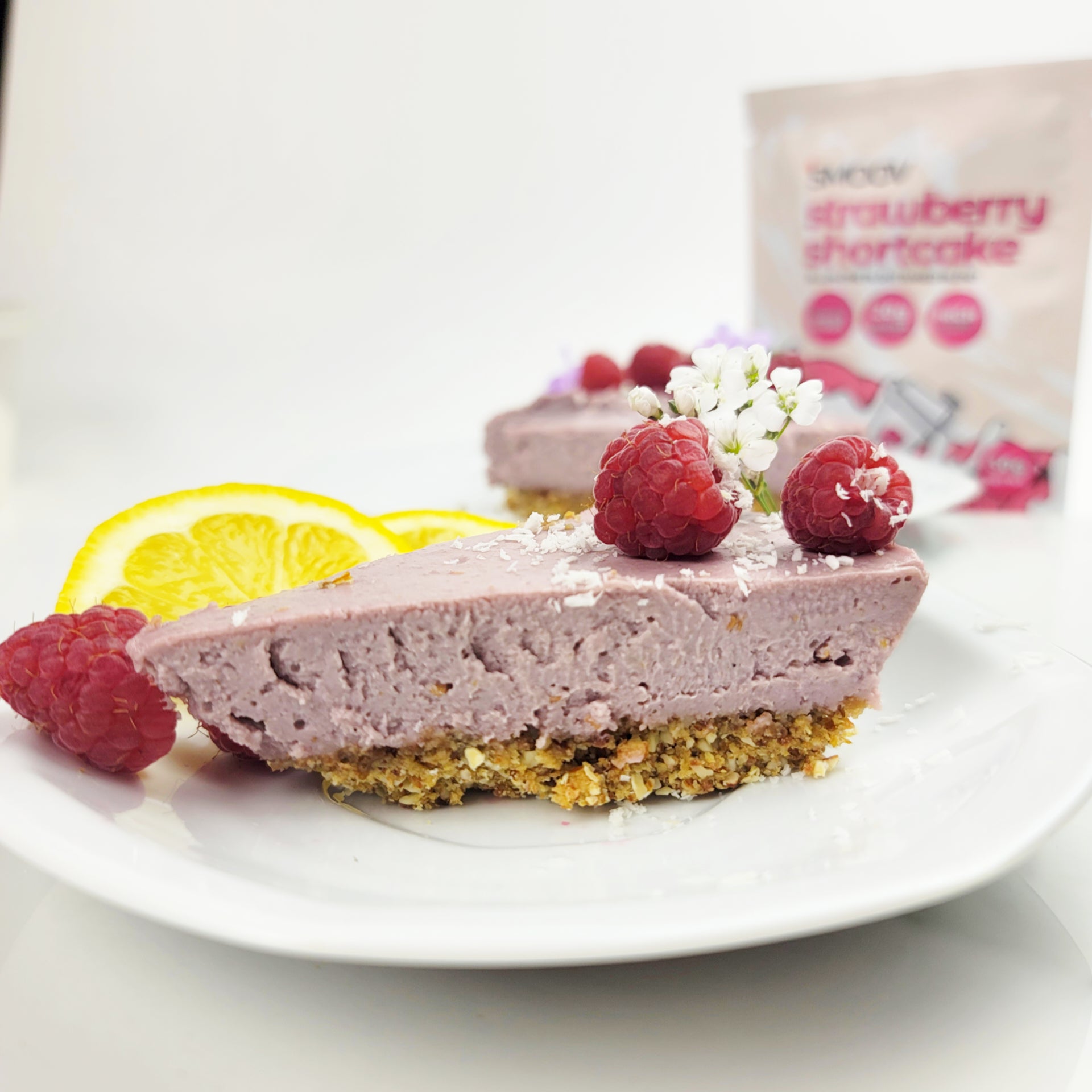 Lemon raspberry vegan cheesecake made using smoov strawberry shortcake all in one blend, healthy meal replacement shake